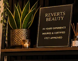 A sign reading 25 years experience, insured and certified, VTCT approved